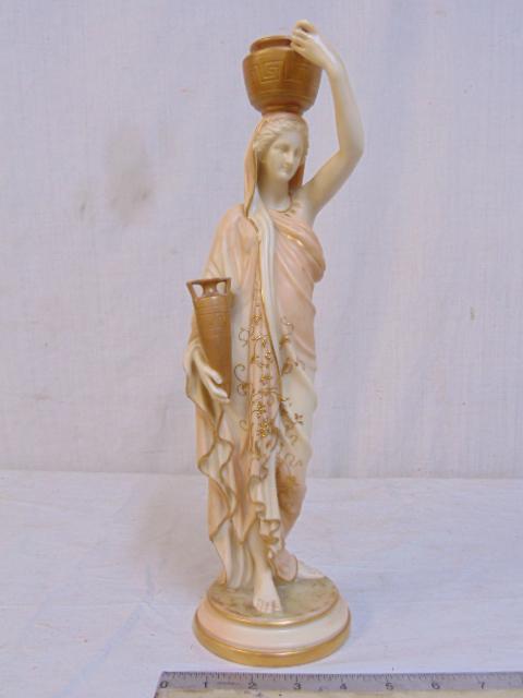 Royal Worcester porcelain figural statue, lady with amphora & urn on head, has a small line back of: Royal Worcester porcelain figural statue, lady with amphora & urn on head, has a small line back of head, below the planter, unsure if hairline, height is 14 5/8"