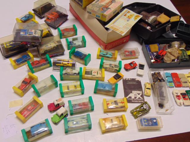 Large lot of 1960's vintage Aurora slot cars.: Large lot of 1960's vintage Aurora slot cars. There are 29 cars in boxes, 5 in larger plastic boxes & 24 smaller cars in boxes, the larger cars include Dodge Street Van; Roarin-Rolls "Golden Ghost"; s