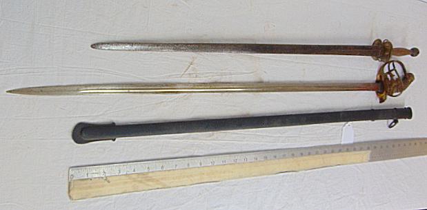 2 swords, Alexander Coppel, Solingen Prussian officer sword with ornate hinged guard, (scabbard: 2 swords, Alexander Coppel, Solingen Prussian officer sword with ornate hinged guard, (scabbard appears repainted) & unusual early sword with small wood & brass handle.