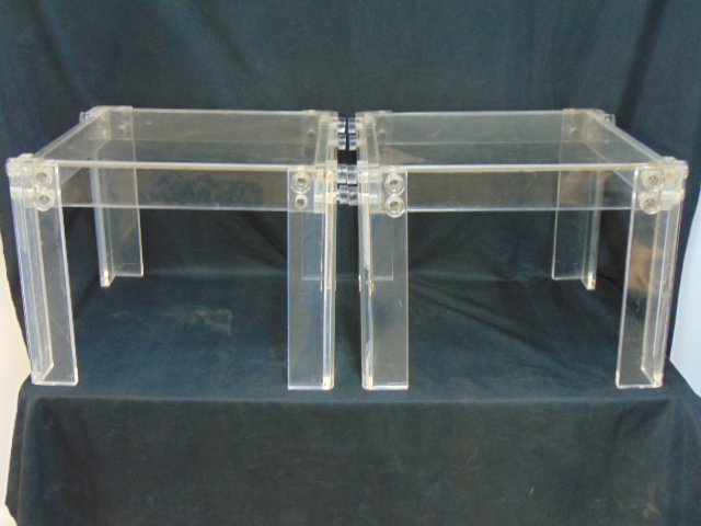 Pair Lucite side tables, Lucite legs, top, each stand is 21.5" by 21.5", height is 16", legs are att: Pair Lucite side tables, Lucite legs, top, each stand is 21.5" by 21.5", height is 16", legs are attached to top frame with Lucite pegs, one peg is missing.