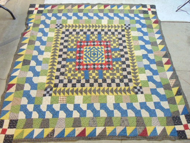 Early quilt, geometric designs in various colors, blue, red, with square center, good condition, qui: Early quilt, geometric designs in various colors, blue, red, with square center, good condition, quilt is 78" by 77"
