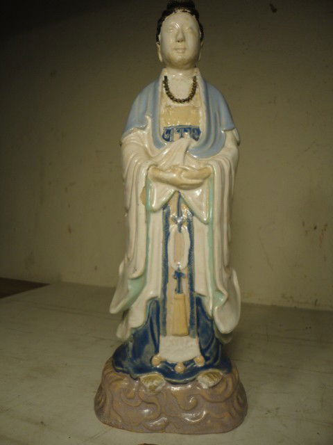 Glazed terra cotta Chinese figure: Glazed terra cotta figure of a Chinese man in a robe, several small chips, primarily on the robe, otherwise in good condition, has stamp on bottom, 14" tall.