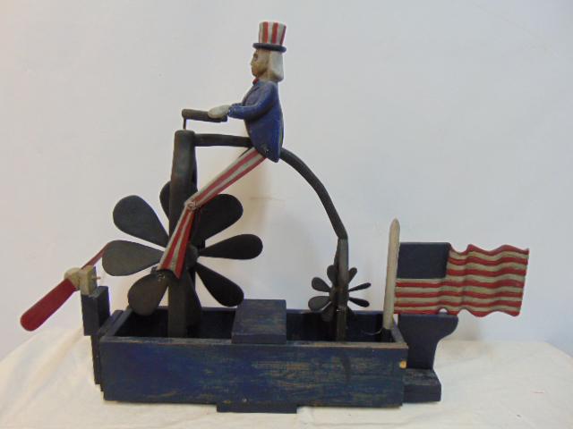 Uncle Sam whirligig, 1970's, with US flag & uncle Sam on a bicycle , 34" long, height is 28" (1 of 5)