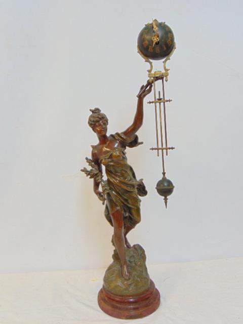 Figural Spelter swing arm clock, "Arondance", par Bruchen, wood base, height as shown is 31", not in (1 of 8)