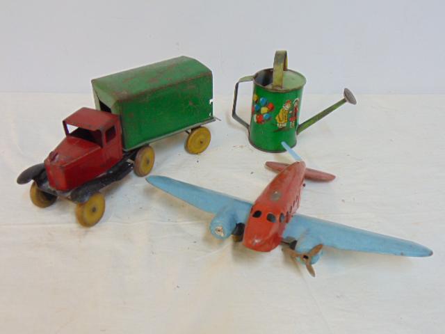 Lot tin toys, airplane, truck with trailer & small watering can, original paint, airplane has (1 of 7)