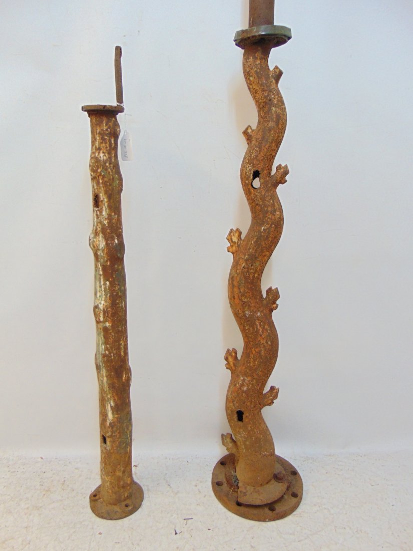 2 iron posts, tree trunk style, rusted appearance, one is 42" tall (gatepost ?), taller post has (1 of 7)
