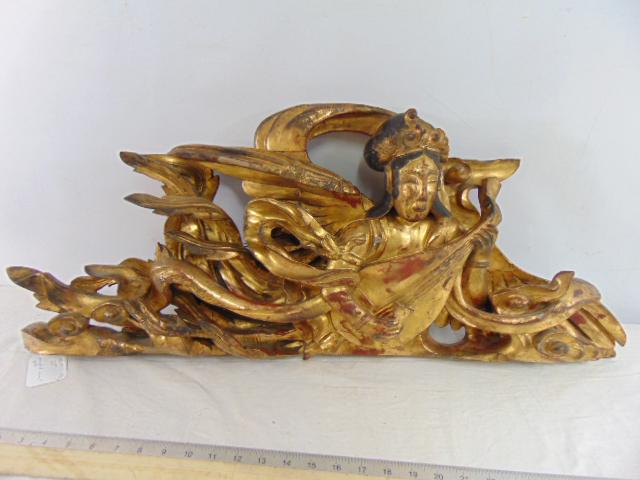 Exceptional gilt Asian wood carving, figure playing mandolin like instrument, 30" wide, height is: Exceptional gilt Asian wood carving, figure playing mandolin like instrument, 30" wide, height is 12.5"