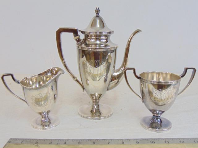 3 piece sterling silver tea set, teapot, creamer, sugar, marked "W" within a wreath, teapot has (1 of 6)