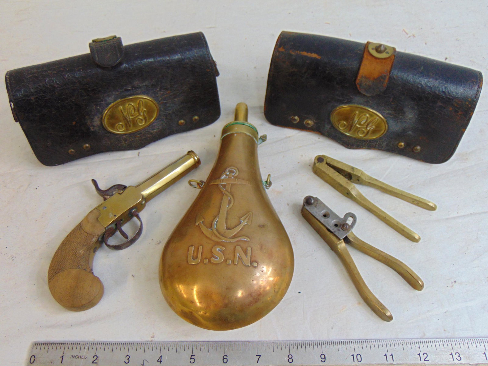 military lot, 19th Century, US Navy powder flask, pair leather cartridge holders, 2 bullet molds,: military lot, 19th Century, US Navy powder flask, pair leather cartridge holders, 2 bullet molds, one by Tiffany & small brass black powder pistol