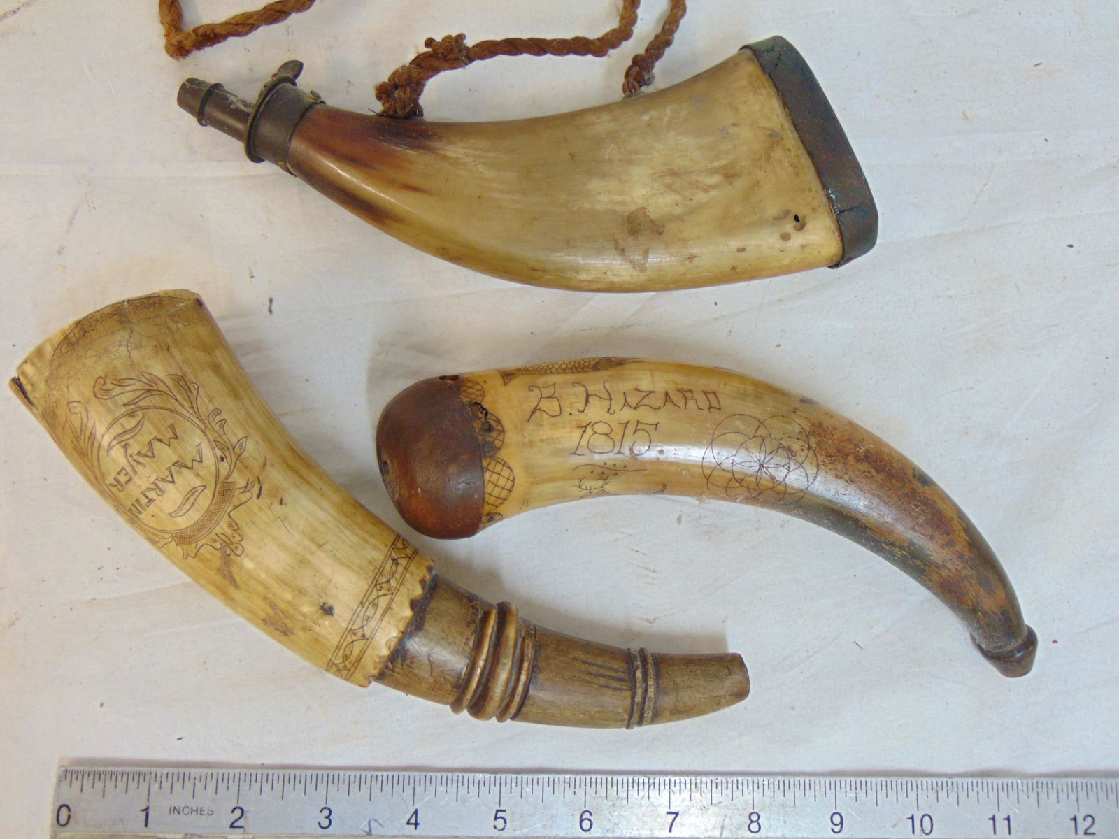 3 horn powder flasks, early 19th Century, decoratively carved, "B. Hazard, 1815", "Martin Mayer" & (1 of 5)