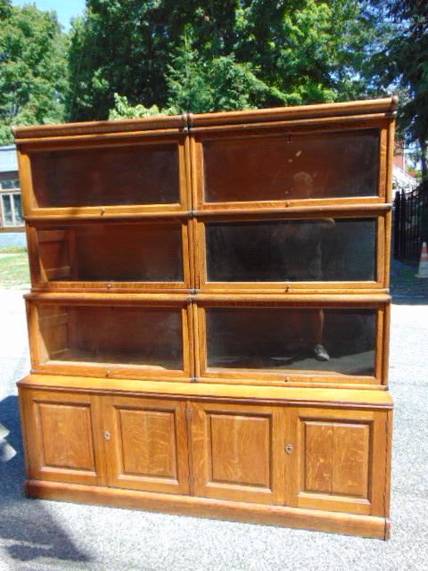 Double stack bookcase over cabinet base, in oak, raised panel door cabinets, with three double (1 of 8)