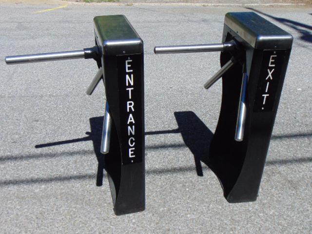 2 station turnstiles, entrance / exit, black painted metal gates with triple turning steel barrier: 2 station turnstiles, entrance / exit, black painted metal gates with triple turning steel barrier rods, each gate is 38" tall.