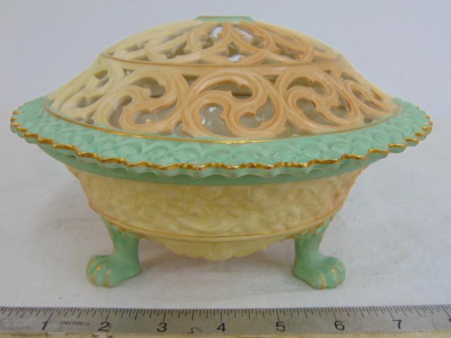 Royal Worcester potpourri bowl, green accents, on three paw feet with reticulated lid, diameter is: Royal Worcester potpourri bowl, green accents, on three paw feet with reticulated lid, diameter is 7.25", in good condition, no repairs, cracks, chips.
