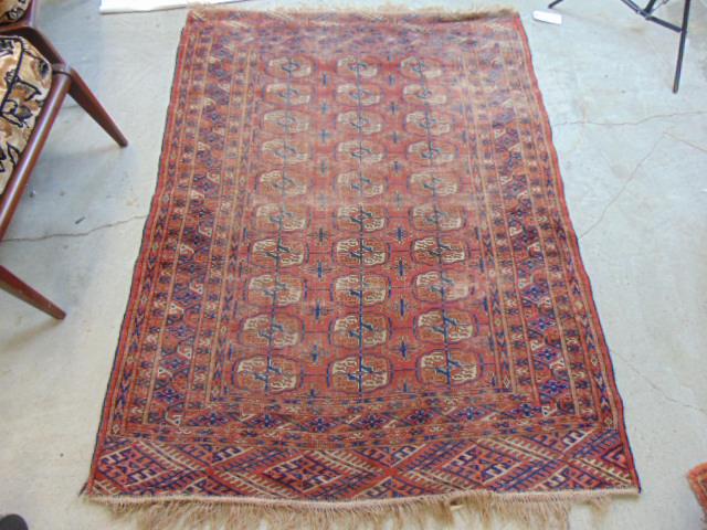 Early Bokhara scatter rug, rust brown, worn, has small hole, carpet is 5'7" by 4'2" (1 of 4)