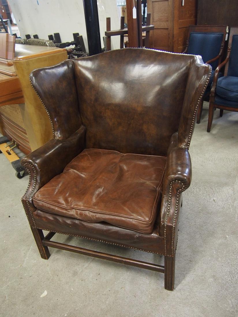Brown leather wing chair, wing back, Chippendale style stretcher base, chair is 35" wide, 26" deep, (1 of 5)