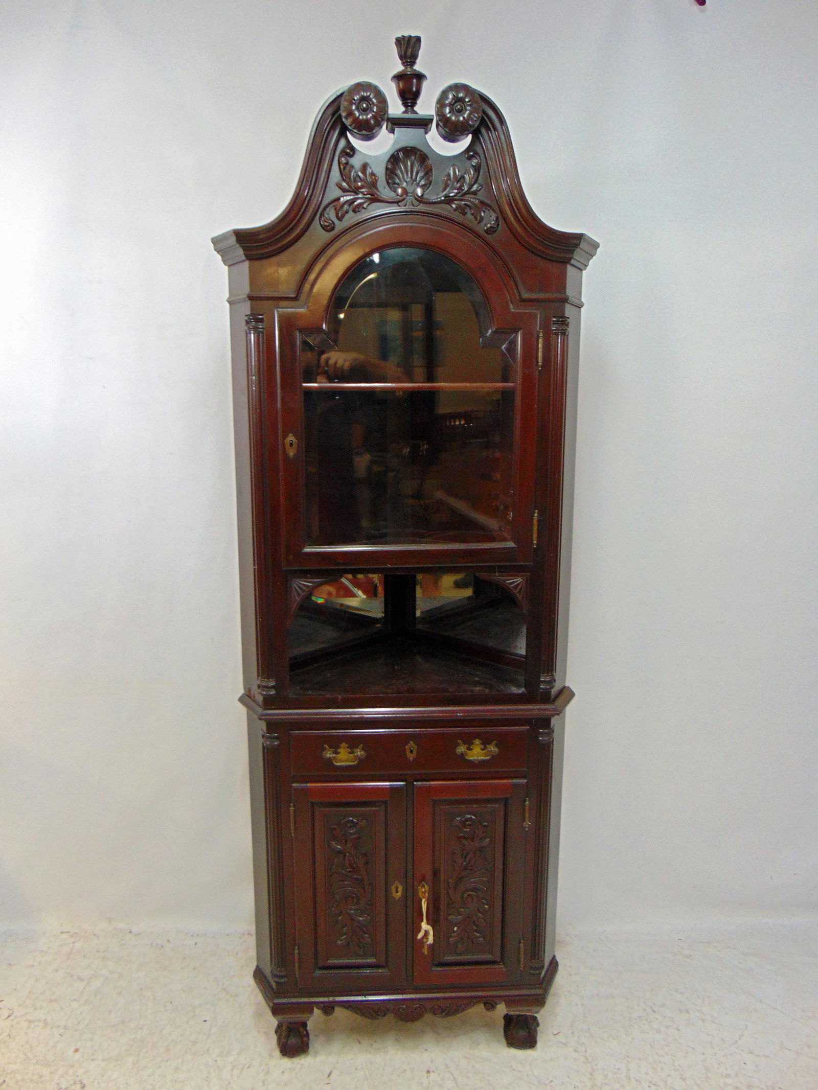Mahogany corner cabinet, carved doors, crest, glass door top, cabinet is 27.5" wide, 17" deep, (1 of 5)