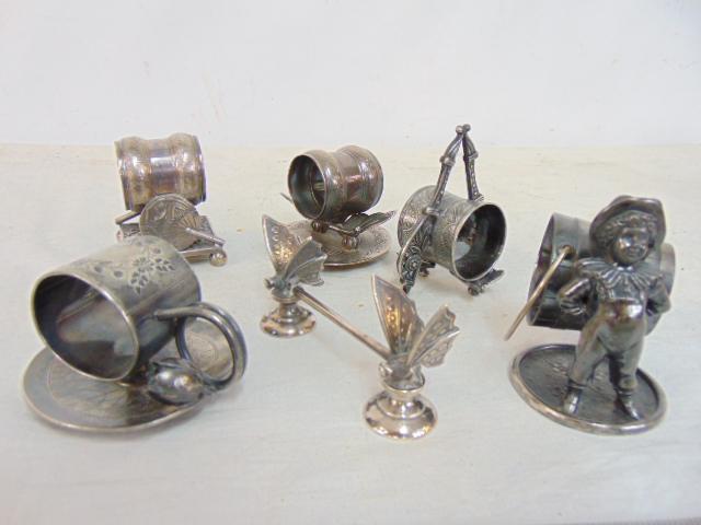 Lot silver plated napkin rings, plus knife rest, Victorian napkin rings with various figural (1 of 4)