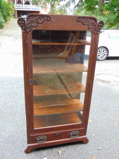 Oak single door bookcase with wood shelves & drawer in base, oak leaf carved detail, cabinet is (1 of 5)