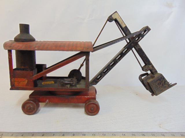 Early toy steam shovel, by Keystone Mfg Co, old labels, toy is 24" long, 7" wide & 14" high (as: Early toy steam shovel, by Keystone Mfg Co, old labels, toy is 24" long, 7" wide & 14" high (as shown), in old red & black paint,