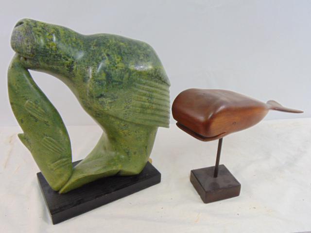 Canadian, Inuit sculpture, & carved wood whale, stone sculpture is titled "Metamorphoses (Kiawak",: Canadian, Inuit sculpture, & carved wood whale, stone sculpture is titled "Metamorphoses (Kiawak", Cape Dorset, Baffin Island Steat,carved walrus eating a fish, in green stone, tail is chipped, sculpt