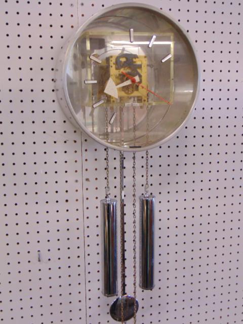 Howard Miller wall clock with chrome weights & pendulum, diameter is 12", depth is 6.5" (1 of 5)