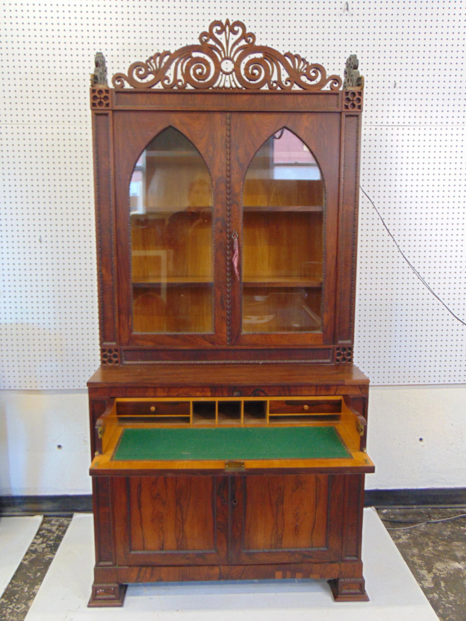 Rosewood secretary desk attributed to Meeks, with carved top, double gothic style doors in upper: Rosewood secretary desk attributed to Meeks, with carved top, double gothic style doors in upper section, pull out drawer with felt work surface in bottom section over 2 doors, decorative carved top m