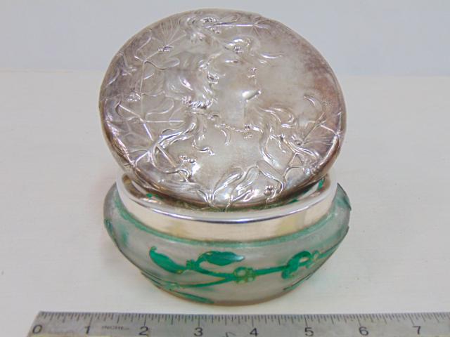 Daum Nancy art nouveau art glass lidded jar, frosted glass with green branches & leaves, silver lid: Daum Nancy art nouveau art glass lidded jar, frosted glass with green branches & leaves, silver lid shows stylized portrait of a lady, 5" in diameter, signed in gilt on bottom.