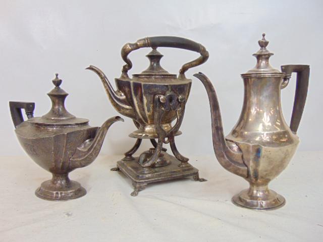 3 Tiffany Makers sterling silver tea & coffee pots, one on stand, wood handles, 100 troy total: 3 Tiffany Makers sterling silver tea & coffee pots, one on stand, wood handles, 100 troy total weight. Teapots on the left & right are uneven on their base, wobbly, and tarnished, handles are a bit lo