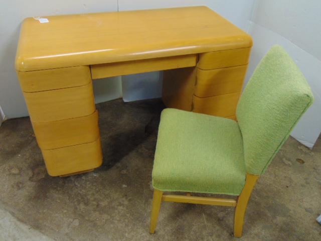 Blond maple knee hole desk with chair, mid Century design in the manner of Wakefield, desk is 44.5": Blond maple knee hole desk with chair, mid Century design in the manner of Wakefield, desk is 44.5" by 23", height is 30", has center drawer flanked by 4 drawers on each side, clean.