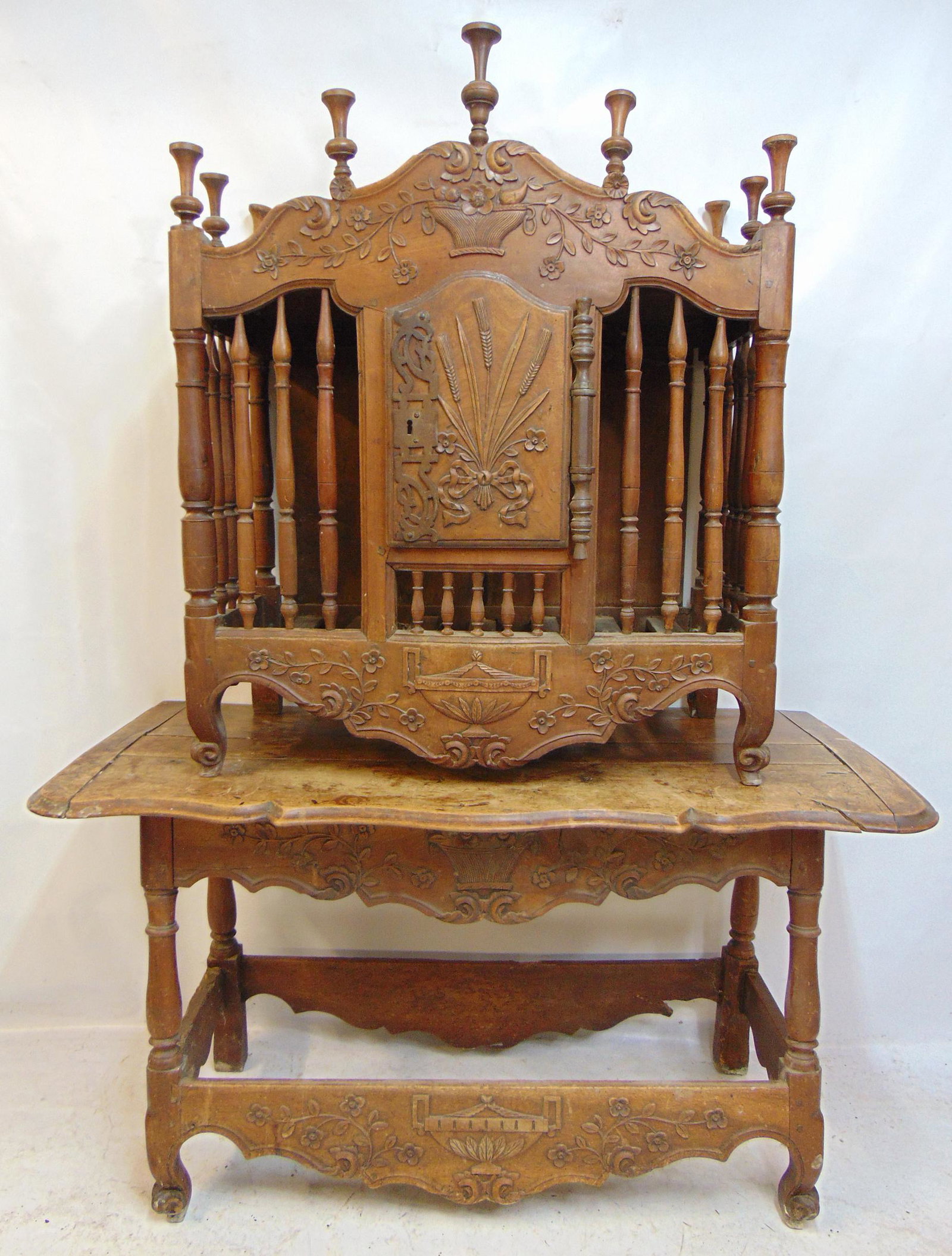 Antique "Panettiere" or country French cabinet for fresh bread and baguettes, with original base,: Antique "Panettiere" or country French cabinet for fresh bread and baguettes, with original base, late 18th, early 19th Century, with fine carved detail, baskets, wheat stalks, base is 48.5" by 22.5",