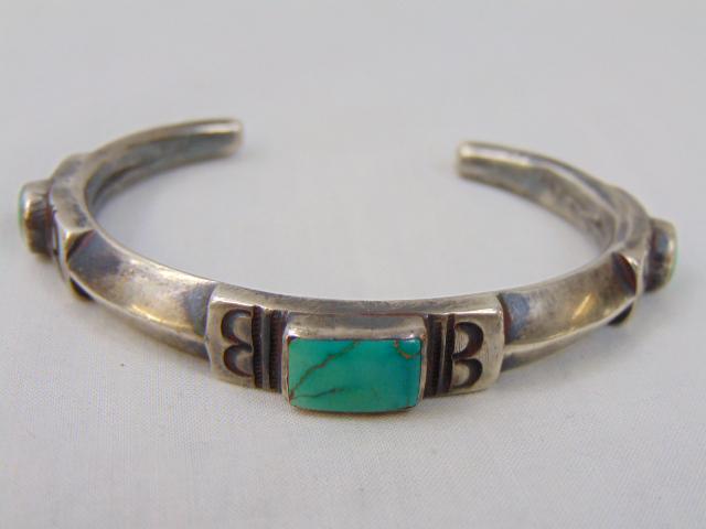 Jewelry. Native American Turquoise Navajo Old Pawn cuff/bracelet, central square turquoise w/ 2: Jewelry. Native American Turquoise Navajo Old Pawn cuff/bracelet, central square turquoise w/ 2 round stone each has hole in middle, 1 1/8" opening gap; 55.75 grams; 1/2" wide; 6 7/8" circumference w/