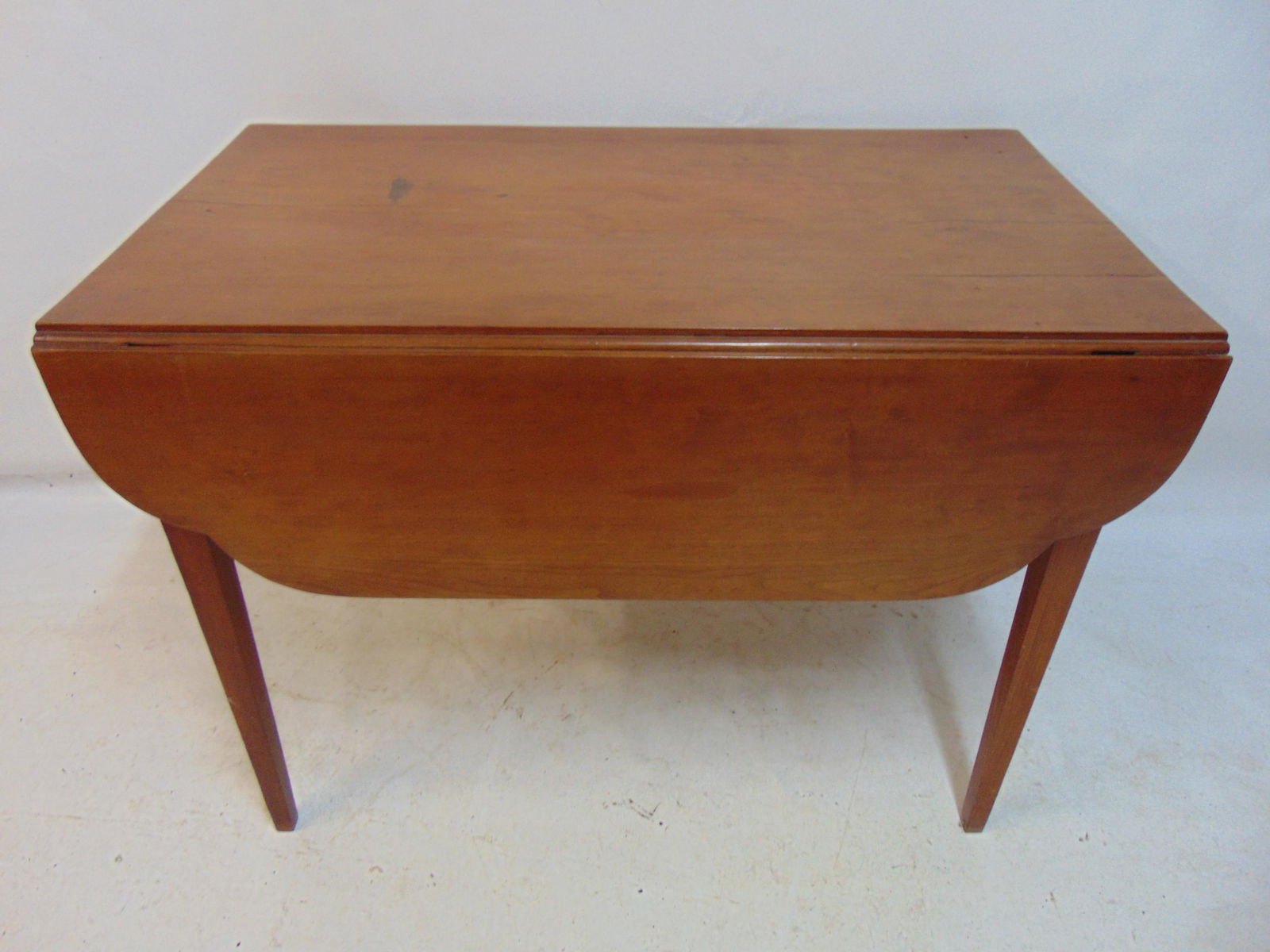 Cherry drop leaf table, table is 38" by 20.75" (38" by 42.5" opened), height is 28.25", top has: Cherry drop leaf table, table is 38" by 20.75" (38" by 42.5" opened), height is 28.25", top has several partial splits.