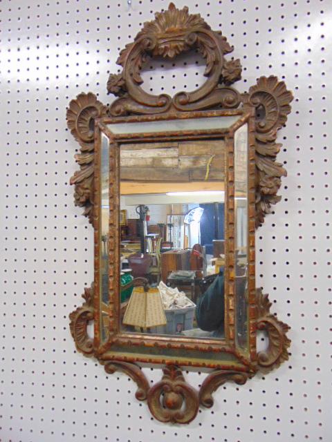Carved antique mirror with glass panel sides, carved floral detail, appears Venetian (?), mirror is: Carved antique mirror with glass panel sides, carved floral detail, appears Venetian (?), mirror is 34" by 18.5".