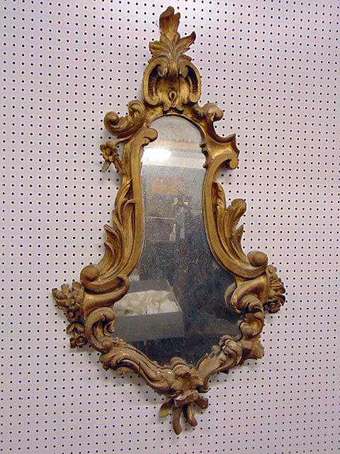 Antique hour glass mirror, carved with cornucopia, gold painted frame, mirror is 48" tall, 28" wide,: Antique hour glass mirror, carved with cornucopia, gold painted frame, mirror is 48" tall, 28" wide, some loss from very top