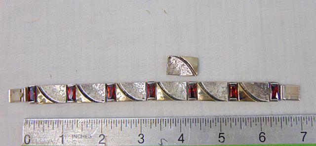 Jewelry. Sterling mix metal bracelet, modern design, garnet, extra link, 7 1/2" length includes: Jewelry. Sterling mix metal bracelet, modern design, garnet, extra link, 7 1/2" length includes clasp, 42.92 grams, hallmark 925, good condition.