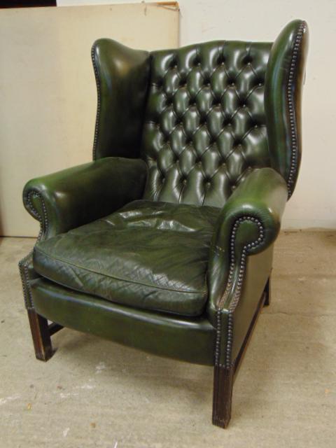 Green leather wingback arm chair, tufted back, stretcher base, chair is 32" wide, 30" deep, height: Green leather wingback arm chair, tufted back, stretcher base, chair is 32" wide, 30" deep, height is 42", seat height is 18"