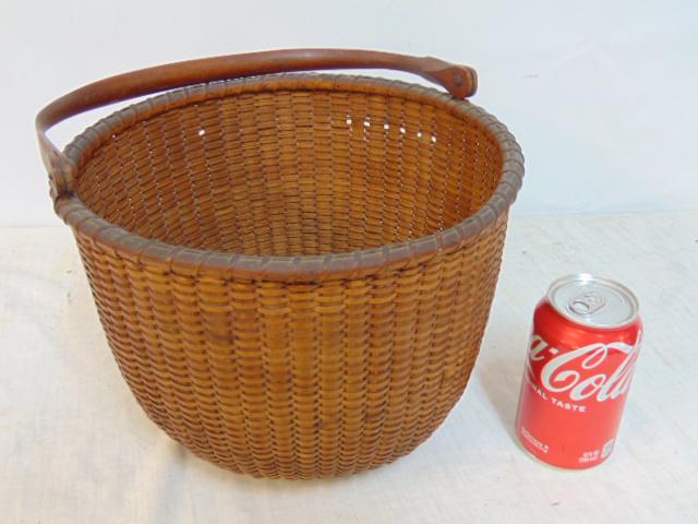 Nantucket lightship basket, labeled William Appleton, with hinged wood handle, few minor breaks,: Nantucket lightship basket, labeled William Appleton, with hinged wood handle, few minor breaks, basket is 10.75" in diameter, height is 8".