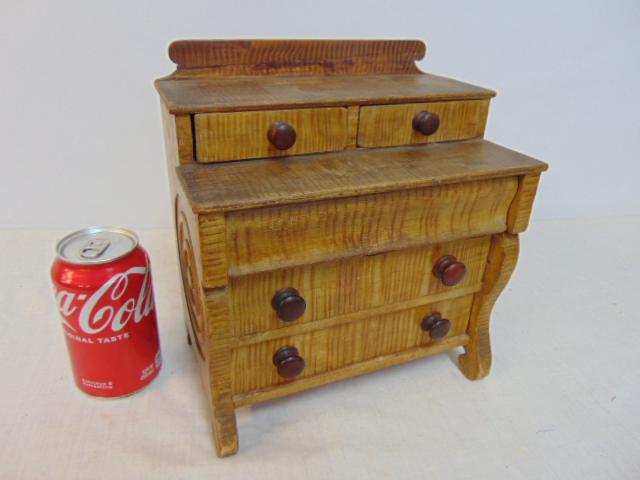 Fine quality miniature chest in original paint, country step back chest with circular carved side: Fine quality miniature chest in original paint, country step back chest with circular carved side decorations with faux tiger maple original painted finish, chest is 9" wide, 5.75" deep, height is 10"