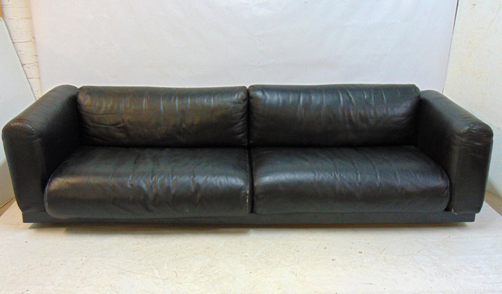 Black leather sofa by Cini Boeri for Knoll / Gavina, Italy, molded plastic with black leather: Black leather sofa by Cini Boeri for Knoll / Gavina, Italy, molded plastic with black leather pillows, sofa is gently used, no damage, tears, sofa is 90" long, 35" deep, height is 21.5"