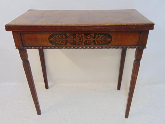 Antique inlaid console game table, beige leather top, inlaid detail, table is 33.25" by 16.75",: Antique inlaid console game table, beige leather top, inlaid detail, table is 33.25" by 16.75", height is 31", open the table is 33.25" by 33.25", some scratches, has carved edge detail.