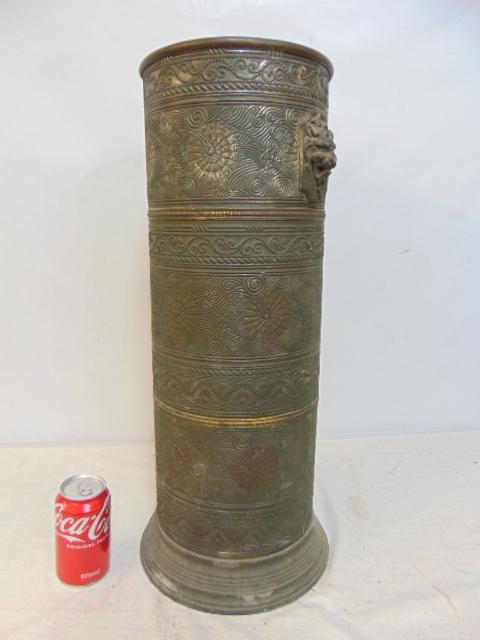 Brass umbrella stand with demon heads & ornate decorations, height is 24": Brass umbrella stand with demon heads & ornate decorations, height is 24"