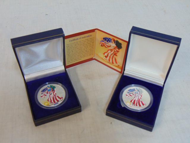 2 American Eagle silver dollar coins in full color, 1999 & 2000, with (one) certificate of: 2 American Eagle silver dollar coins in full color, 1999 & 2000, with (one) certificate of authenticity, 1 oz