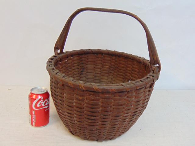 Basket with wood handle, some loss, basket is 14" in diameter, height is 8.5": Basket with wood handle, some loss, basket is 14" in diameter, height is 8.5"