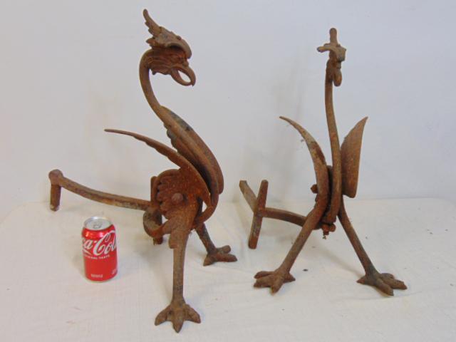 Pair iron griffin andirons, rusted, one is missing rear support leg, comb on top as well, 19.5": Pair iron griffin andirons, rusted, one is missing rear support leg, comb on top as well, 19.5" tall, as found. andirons are