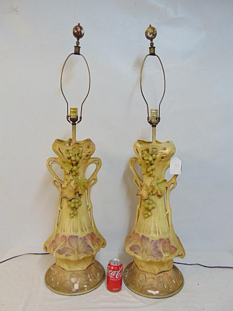 Pair of large Amphora style table lamps with grape & leaf decoration, wood bases, some leaves are: Pair of large Amphora style table lamps with grape & leaf decoration, wood bases, some leaves are chipped, lamps are 25" tall (excluding socket extensions)