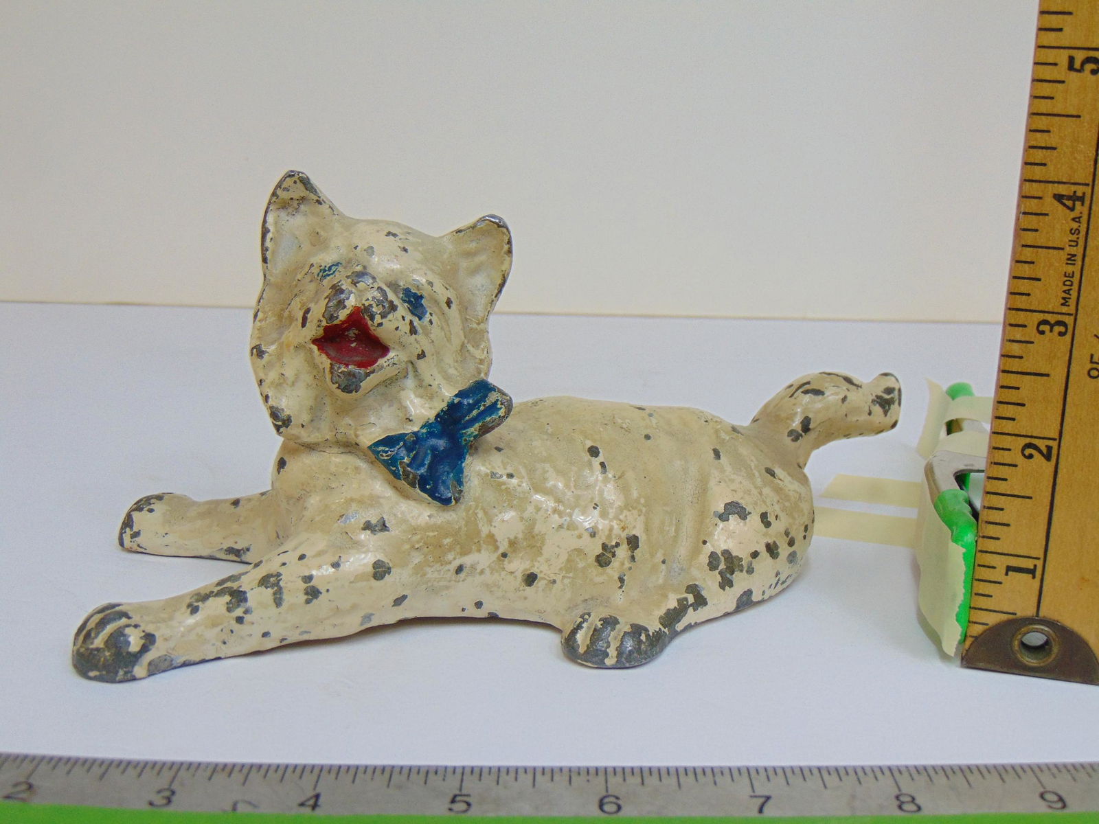 Cat Doorstop, metal (not cast iron, original paint, cat is laying down with spread legs, open mouth, (1 of 4)