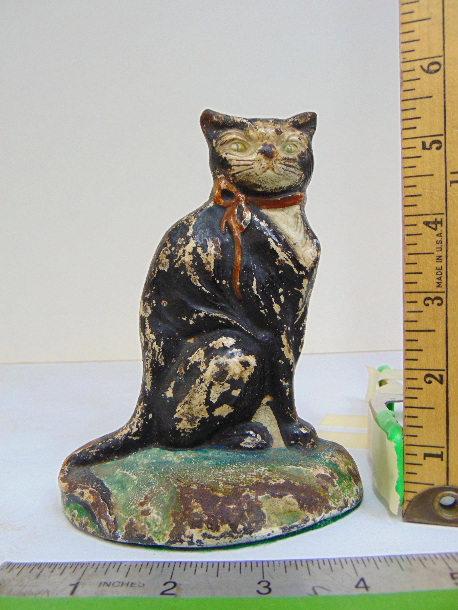 Small cast iron doorstop by Johnson, black & white cat with bow collar, 4 5/8" wide, height is 6" (1 of 4)