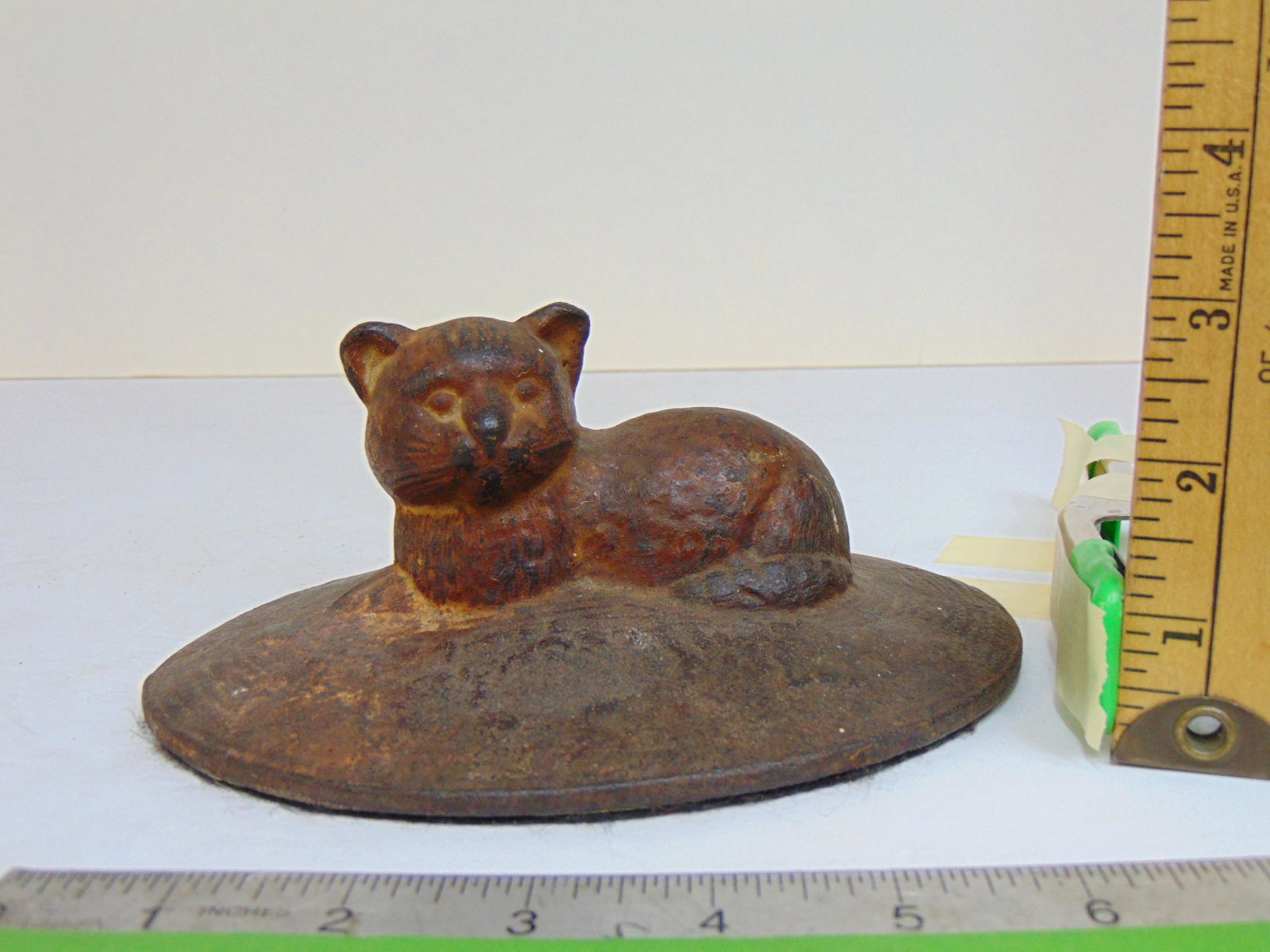 Cast iron cat doorstop, cat on oval base, base is 6 7/8" by 5.5" (1 of 4)