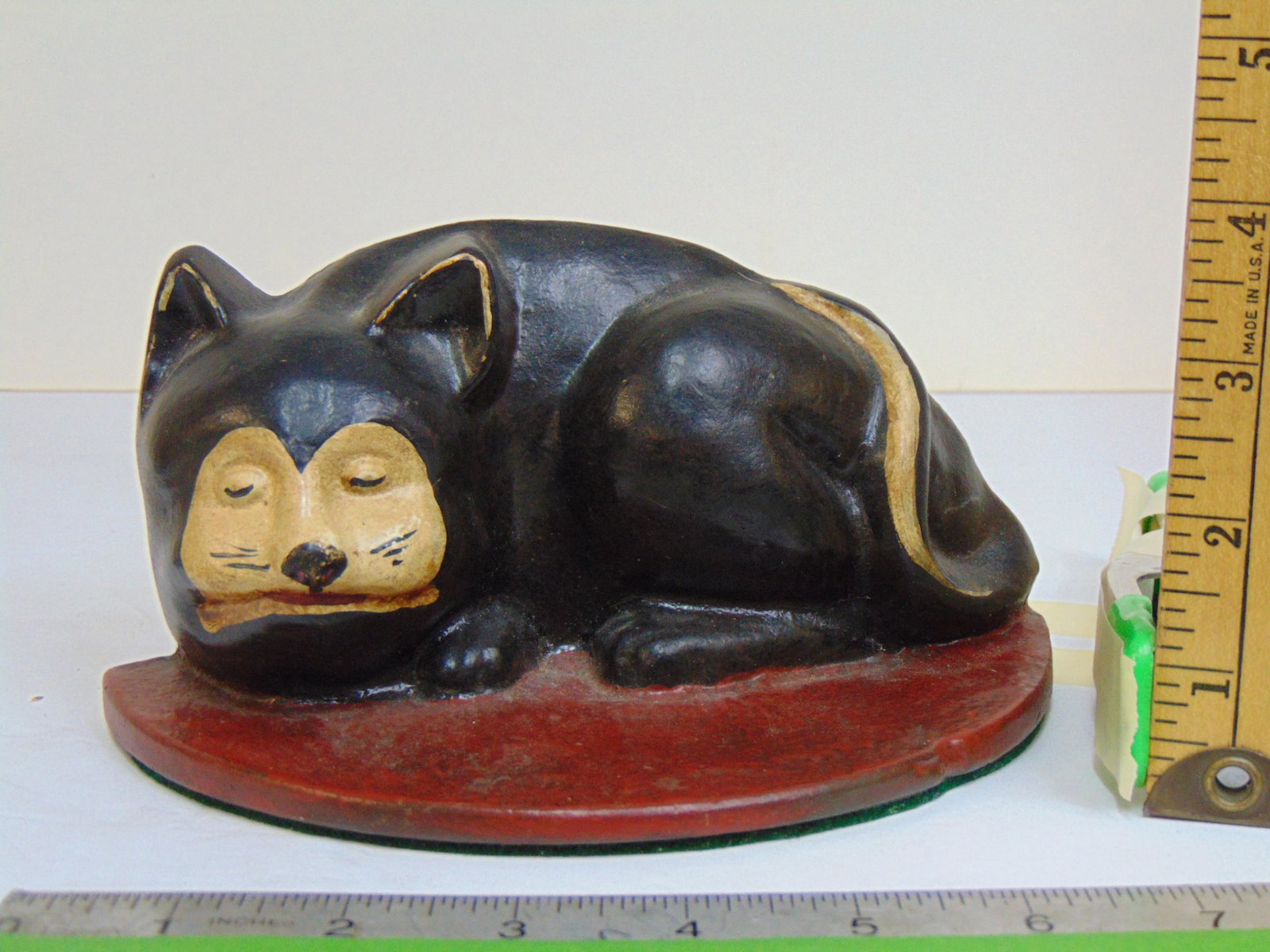 Cast iron Cat doorstop, tuxedo cat sleeping, several numbers on reverse, can not make out signature, (1 of 5)