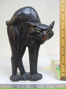 Cast iron Cat doorstop, A.M. Greenblatt Studio, black cat with arched back, copyright 1927, height: Cast iron Cat doorstop, A.M. Greenblatt Studio, black cat with arched back, copyright 1927, height is 9"